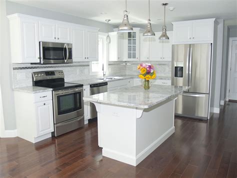 white kitchen cabinets white appliances and stainless steel sink|white kitchen with stainless steel appliances.